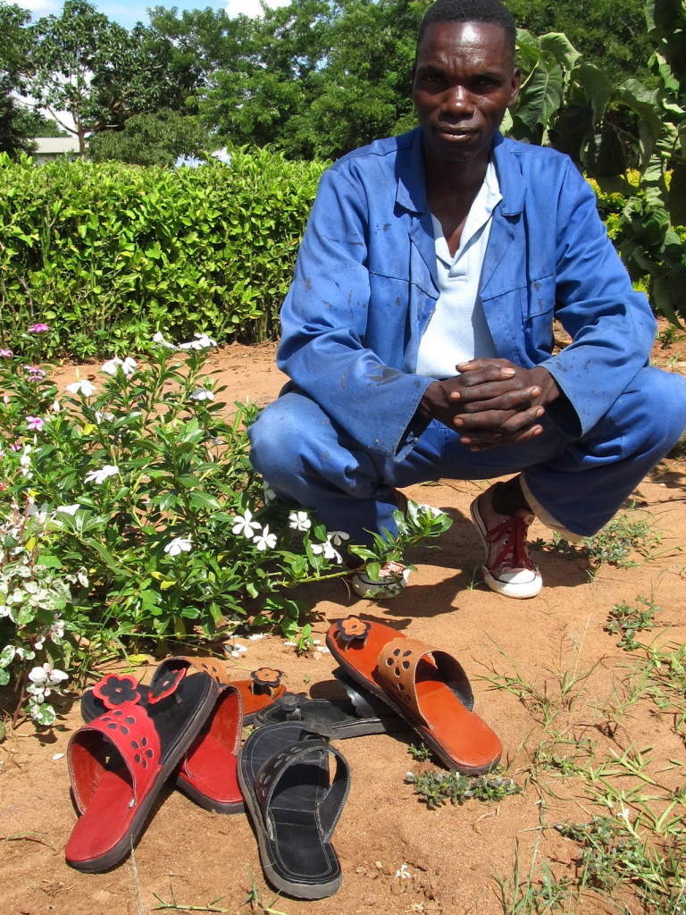 Grant Kaiyatsa poses with his handmade shoes