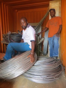 Emmanuel Njoloma and Fackson Dilli showing off the cables to connect Mbera